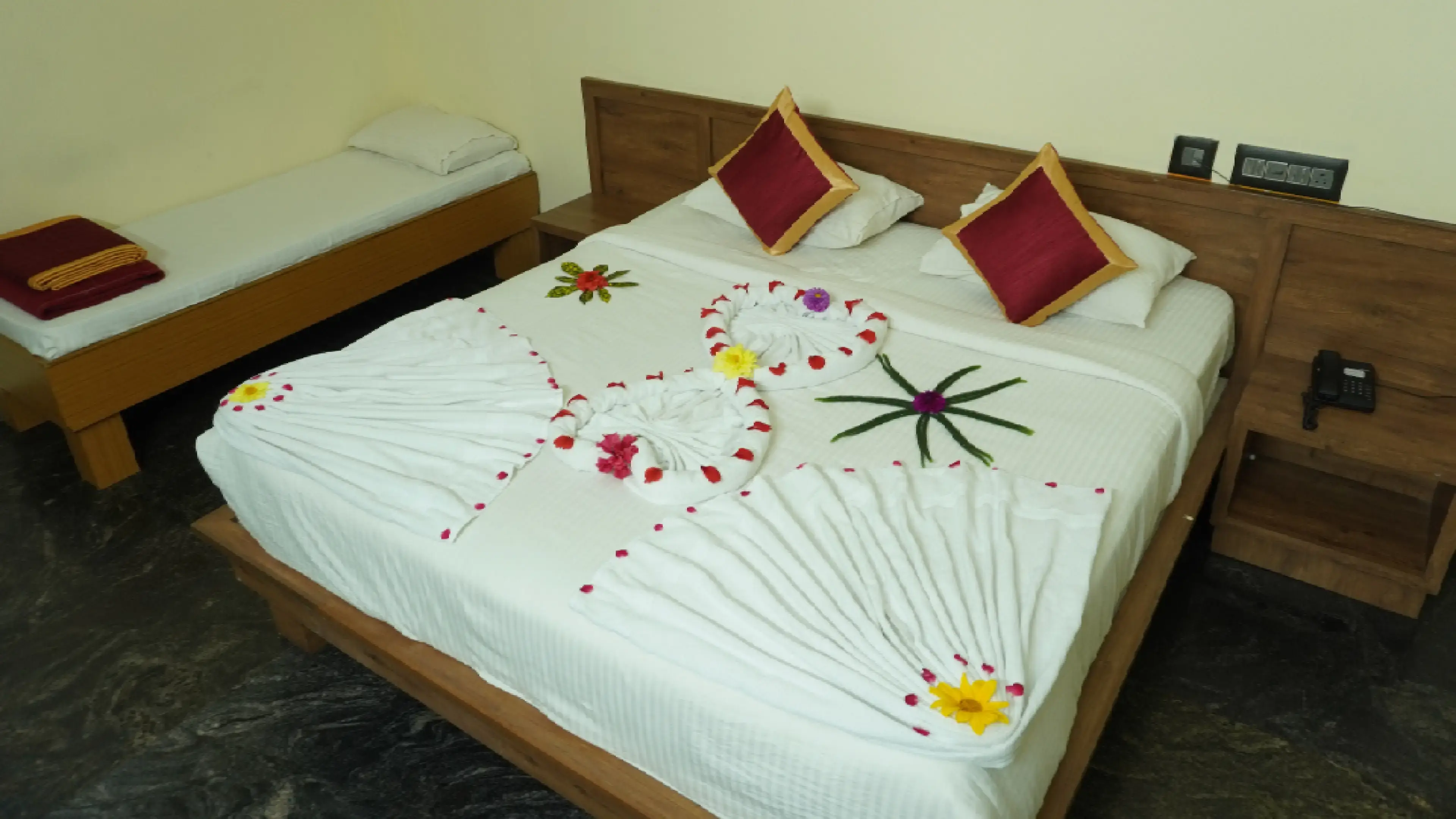 Deluxe Triple Room with king bed at MS Lotus Resorts